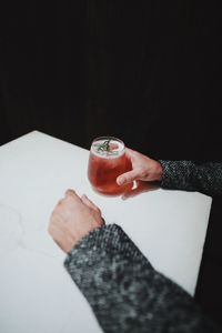 Close-up of hand holding wine glass