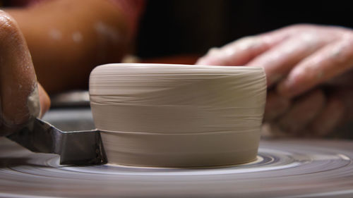 A potter's scraper for giving a clay blank its final shape. working in a pottery workshop 