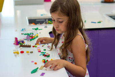 Girl playing on table