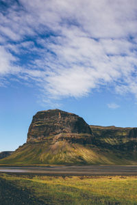 Scenic view of landscape against cloudy sky