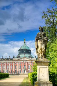 Statue of building against cloudy sky