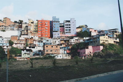 Houses in city against sky