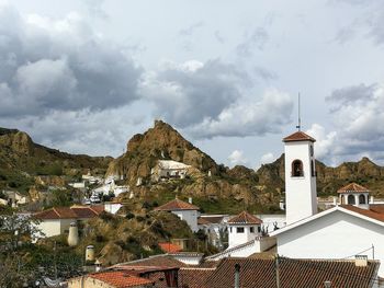 Houses against sky in city