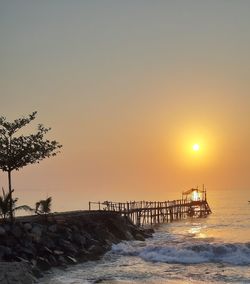 Scenic view of sea against clear sky during sunset