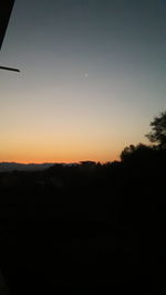 Scenic view of silhouette landscape against sky during sunset