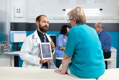 Midsection of doctor working at clinic