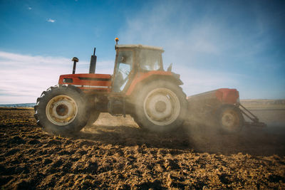 Old tractor working on the field