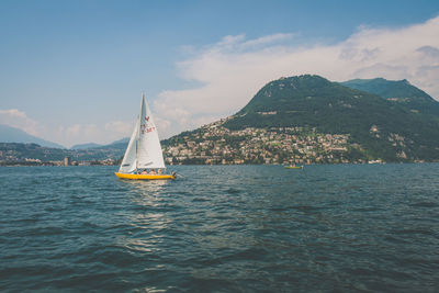 Sailboat sailing in lake