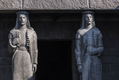 Low angle view of statue against building