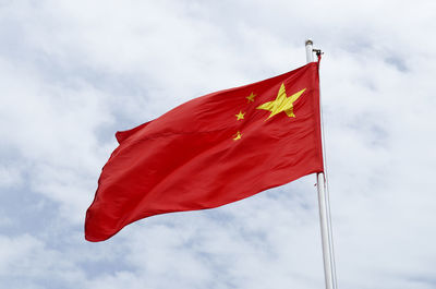 Low angle view of flag against sky