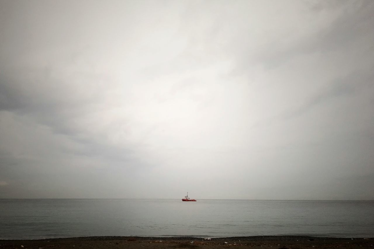 sea, horizon over water, water, nautical vessel, transportation, mode of transport, tranquil scene, sky, tranquility, scenics, boat, beauty in nature, nature, waterfront, sailing, seascape, idyllic, cloud - sky, sailboat, copy space