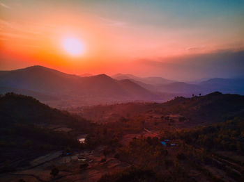 Scenic view of mountains against sky during sunset