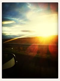 Sun shining through clouds
