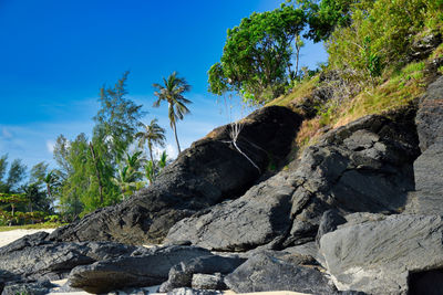 Low angle view of rock formation against sky