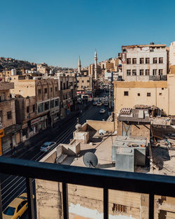 High angle view of buildings against clear blue sky