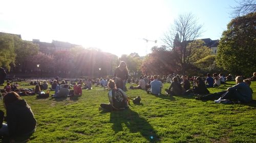 People on grassy field in park