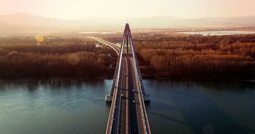 High angle view of bridge over river during sunset