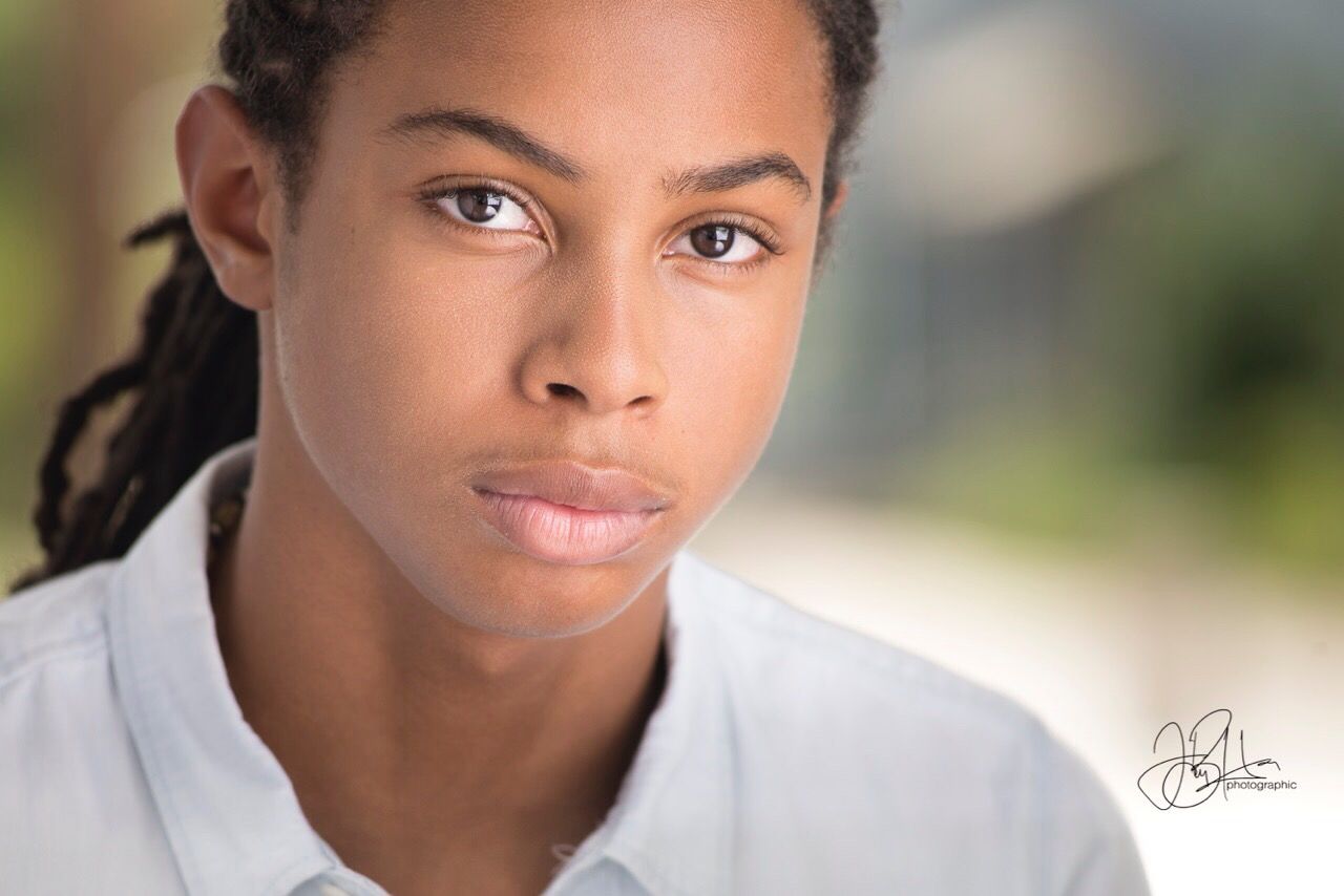 person, portrait, headshot, focus on foreground, lifestyles, front view, close-up, leisure activity, casual clothing, cute, human face, contemplation, day, selective focus