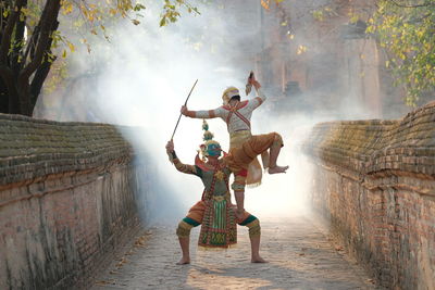 People enjoying in traditional clothing