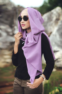 Woman wearing sunglasses standing outdoors