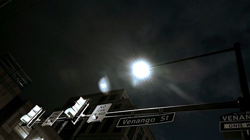 Low angle view of illuminated road at night