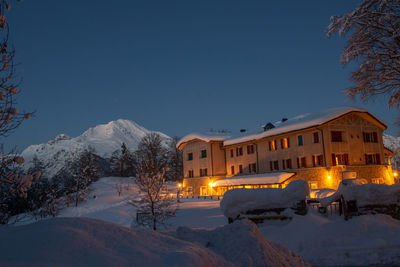 House in the snow at sunset