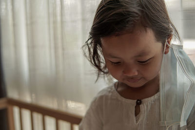 Portrait of cute girl looking down