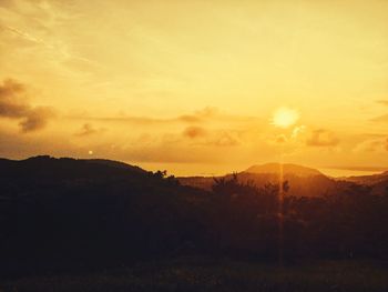 Scenic view of mountains against sky during sunset