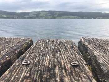 Close-up of wooden pier over lake