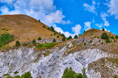 Low angle view of rocks against sky