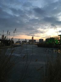 View of city against sky during sunset