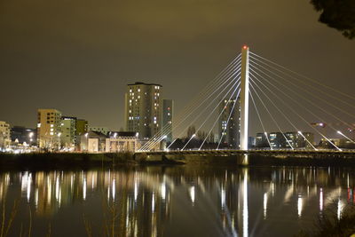 Low angle view of suspension bridge at night