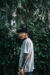 Man standing in forest