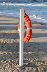 Close-up of life belt on beach