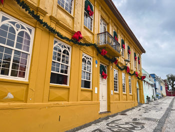 Buildings in city against sky
