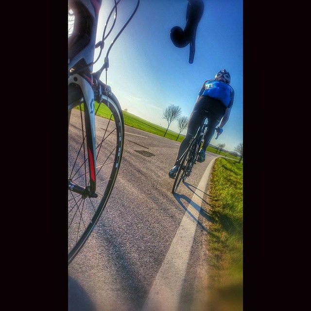 transportation, full length, mid-air, land vehicle, lifestyles, street, road, mode of transport, bicycle, sunlight, shadow, on the move, sport, leisure activity, skateboard, men, riding, day