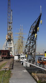 Pier at harbor against sky