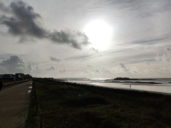 Scenic view of beach against sky during sunset