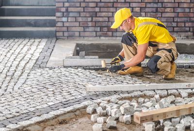 Side view of man working at construction site