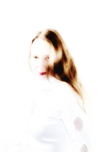 Close-up portrait of a young woman over white background