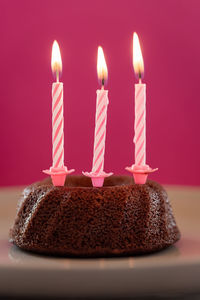 Close-up of candles on cake