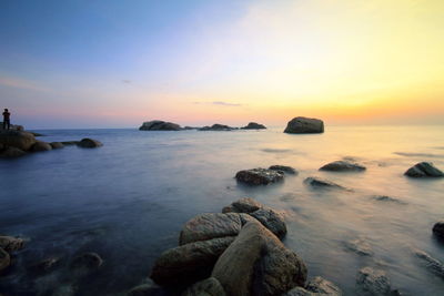 Scenic view of sea at sunset