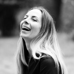 Close-up of woman laughing outdoors