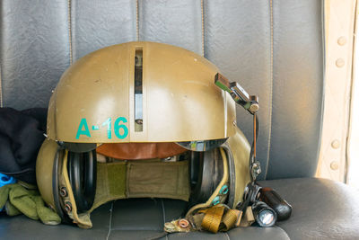 Close-up of helmet on sofa