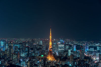 Illuminated buildings in city at night