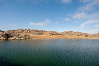 Brown grass on a small, rocky island
