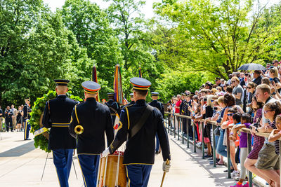 Rear view of people walking in park