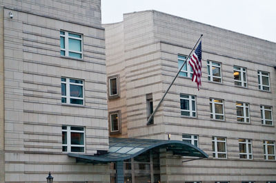 Low angle view of flag in city