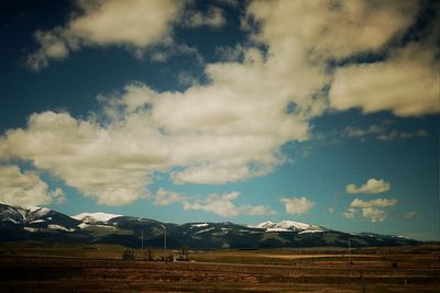 Scenic view of landscape against cloudy sky