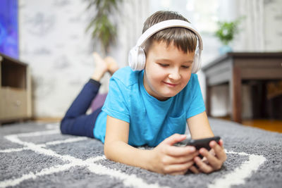 Portrait of boy using mobile phone